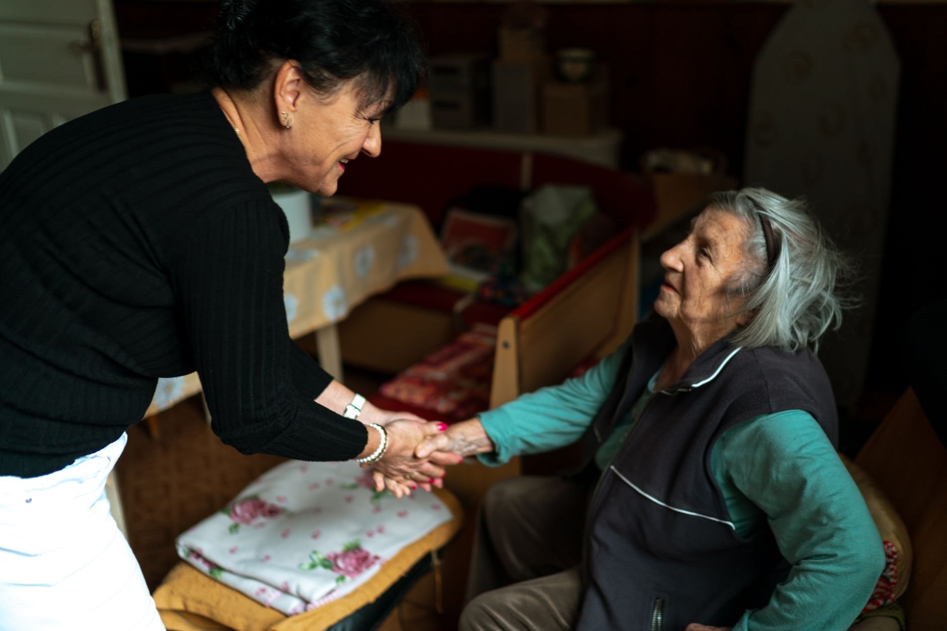 An elderly woman warmly greeted at home — CrestCare Medical brings genuine care with every visit